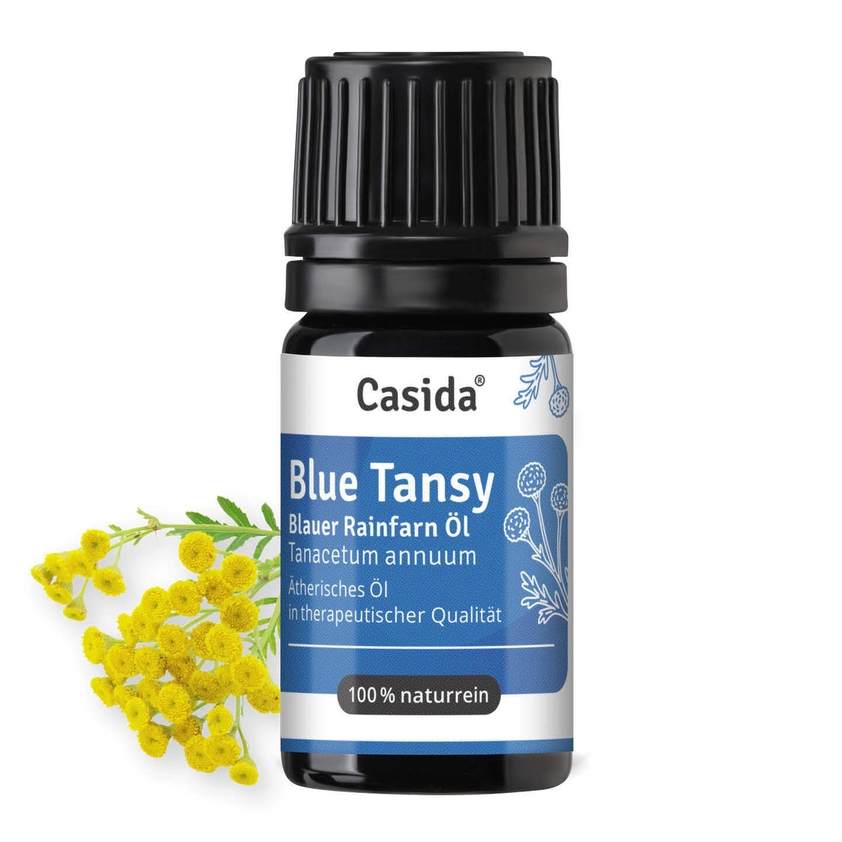 Casida Blue Tansy Blauer Rainfarn Öl in dunkler Flasche neben gelben Blüten