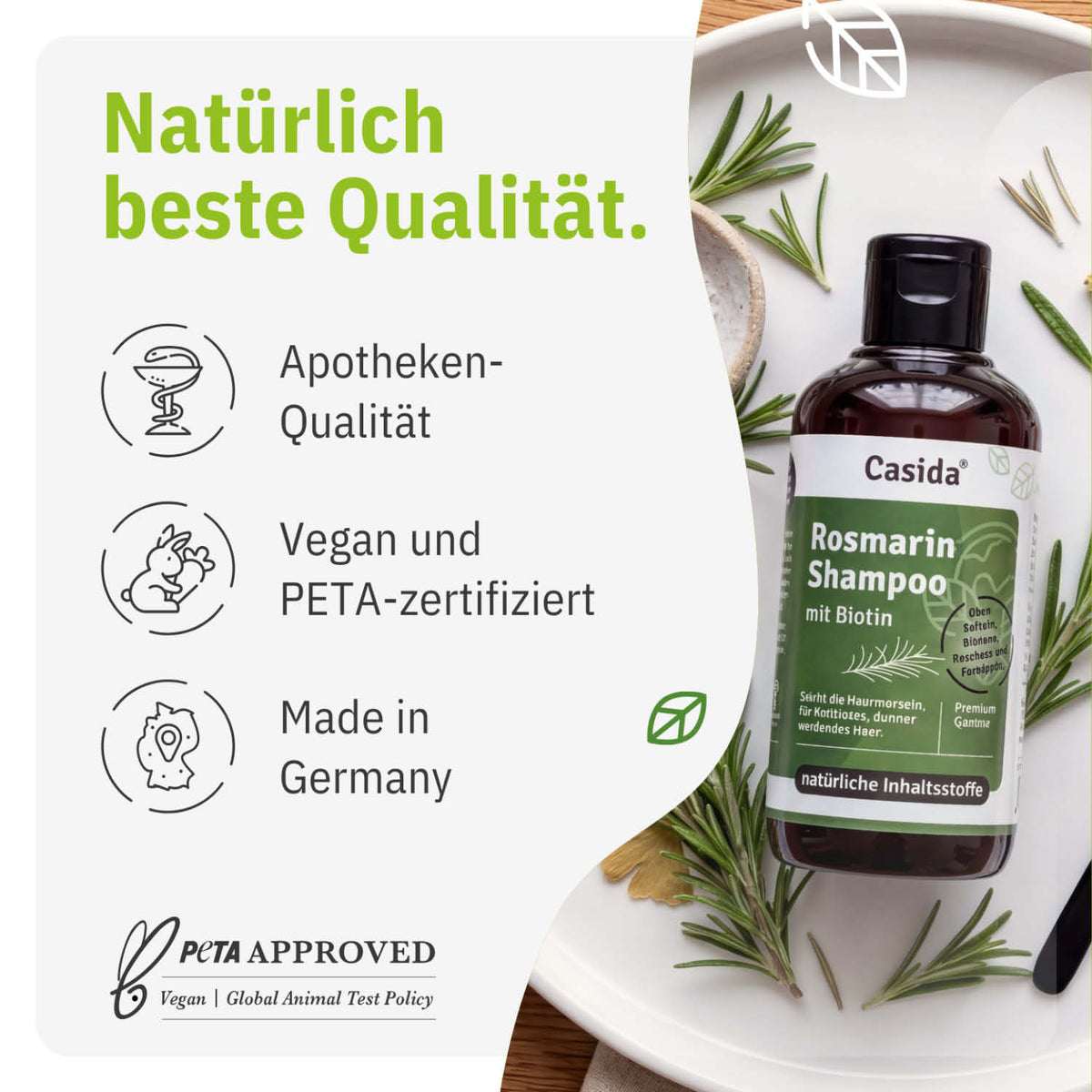 Rosmarin shampoo with biotin in a dark bottle, surrounded by rosemary sprigs, labeled vegan and PETA-certified.