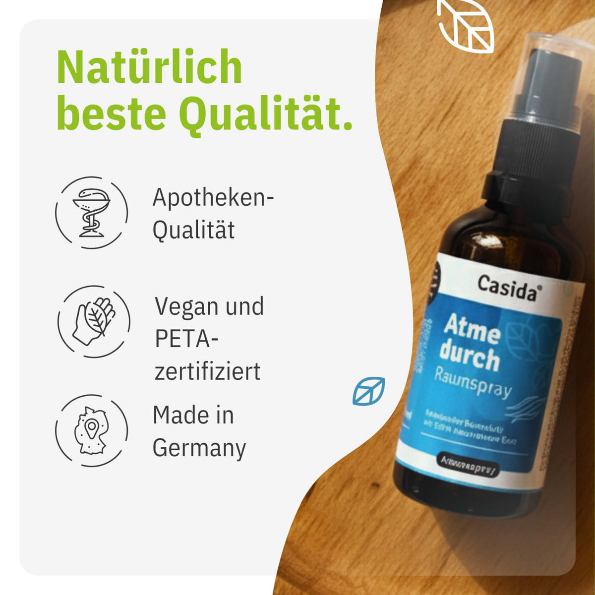 Atme durch Raumspray in a brown bottle with a spray nozzle, featuring a blue and white label, placed on a light background.
