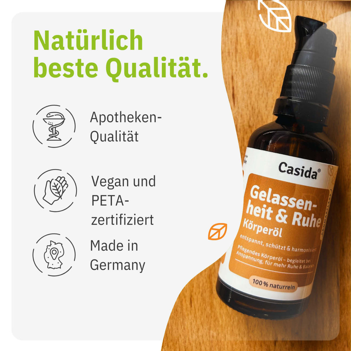 Gelassenheit & Ruhe Körperöl in a brown glass bottle with a black pump, featuring green and white text on a wooden backgro...