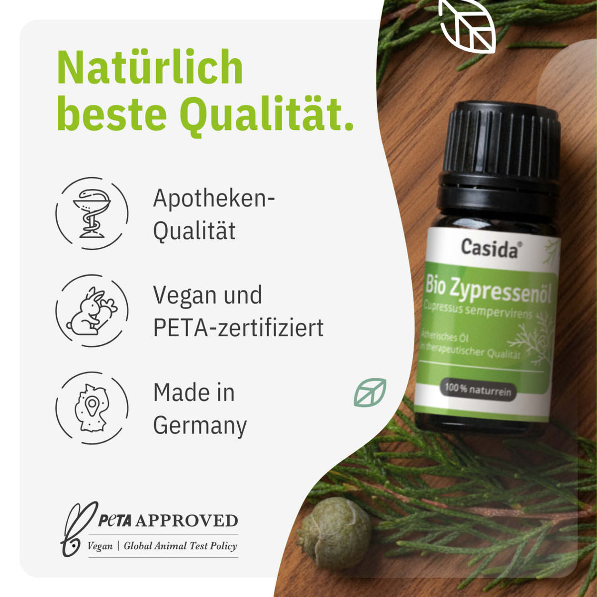 Bio Zypressenöl in a dark glass bottle with a green label, surrounded by cypress leaves, 10 ml size.