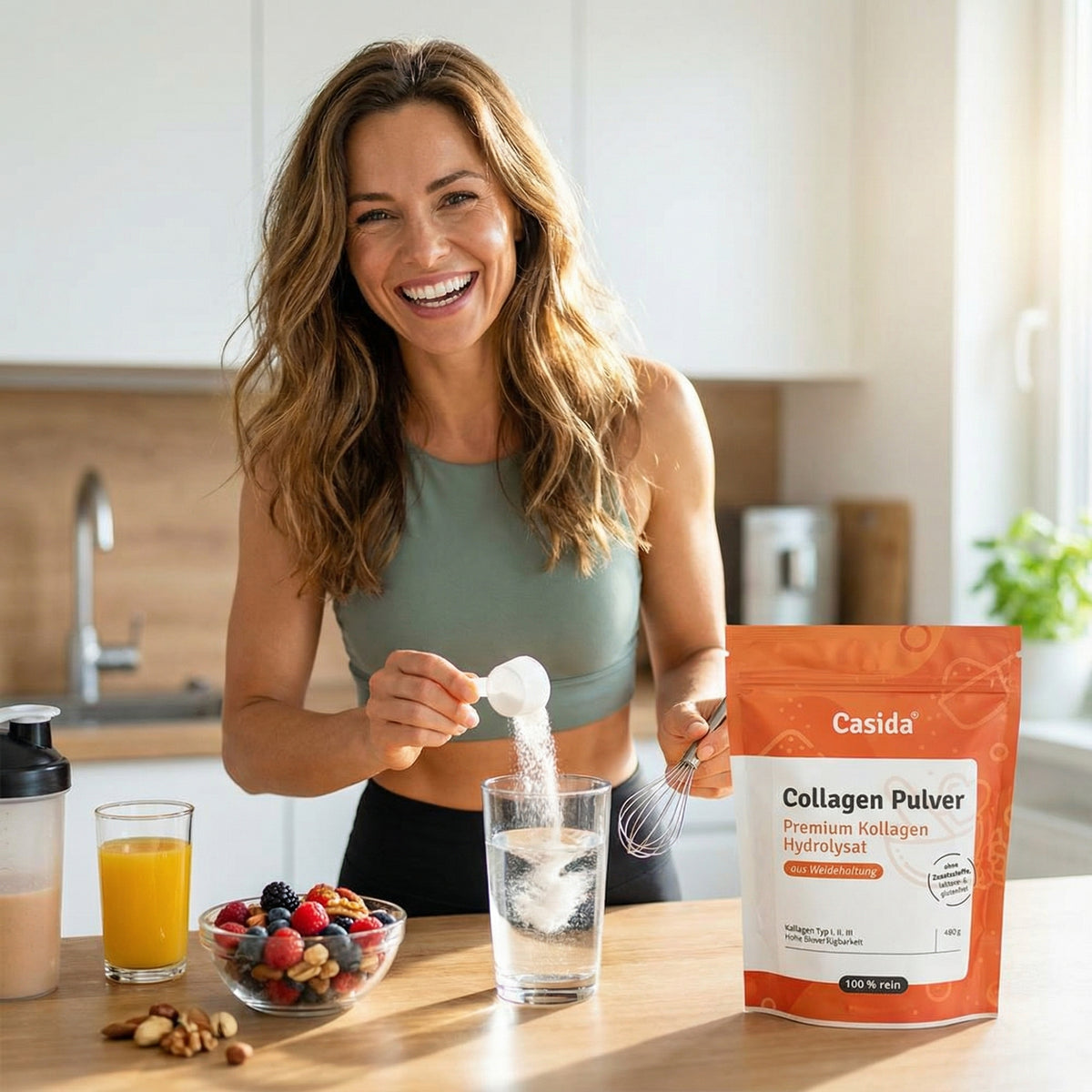 Collagen Pulver in an orange bag on a kitchen counter, with a woman adding powder to a glass of water.