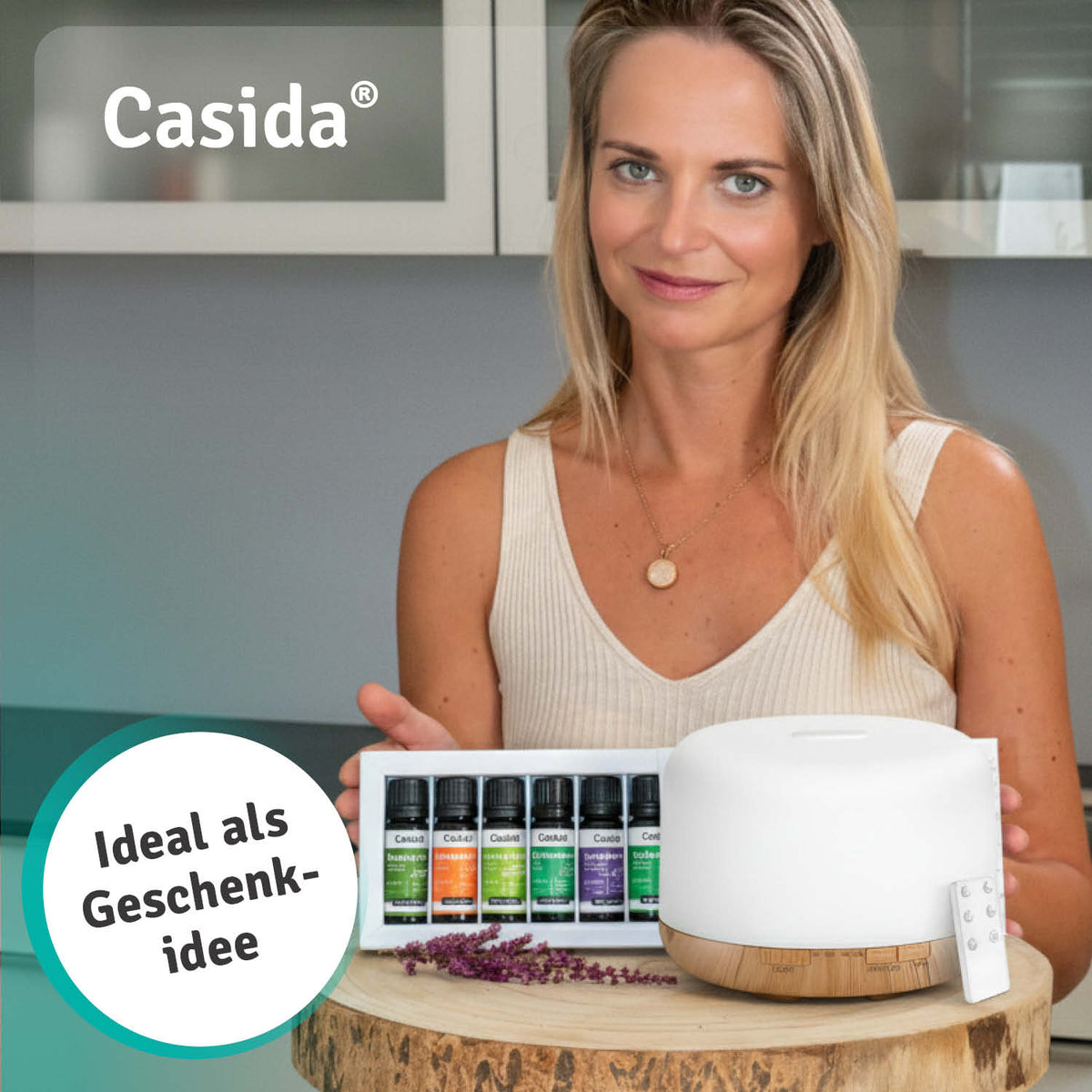 Aroma diffuser with remote control, 500 ml capacity, white design, displayed with essential oil bottles and a woman holdin...