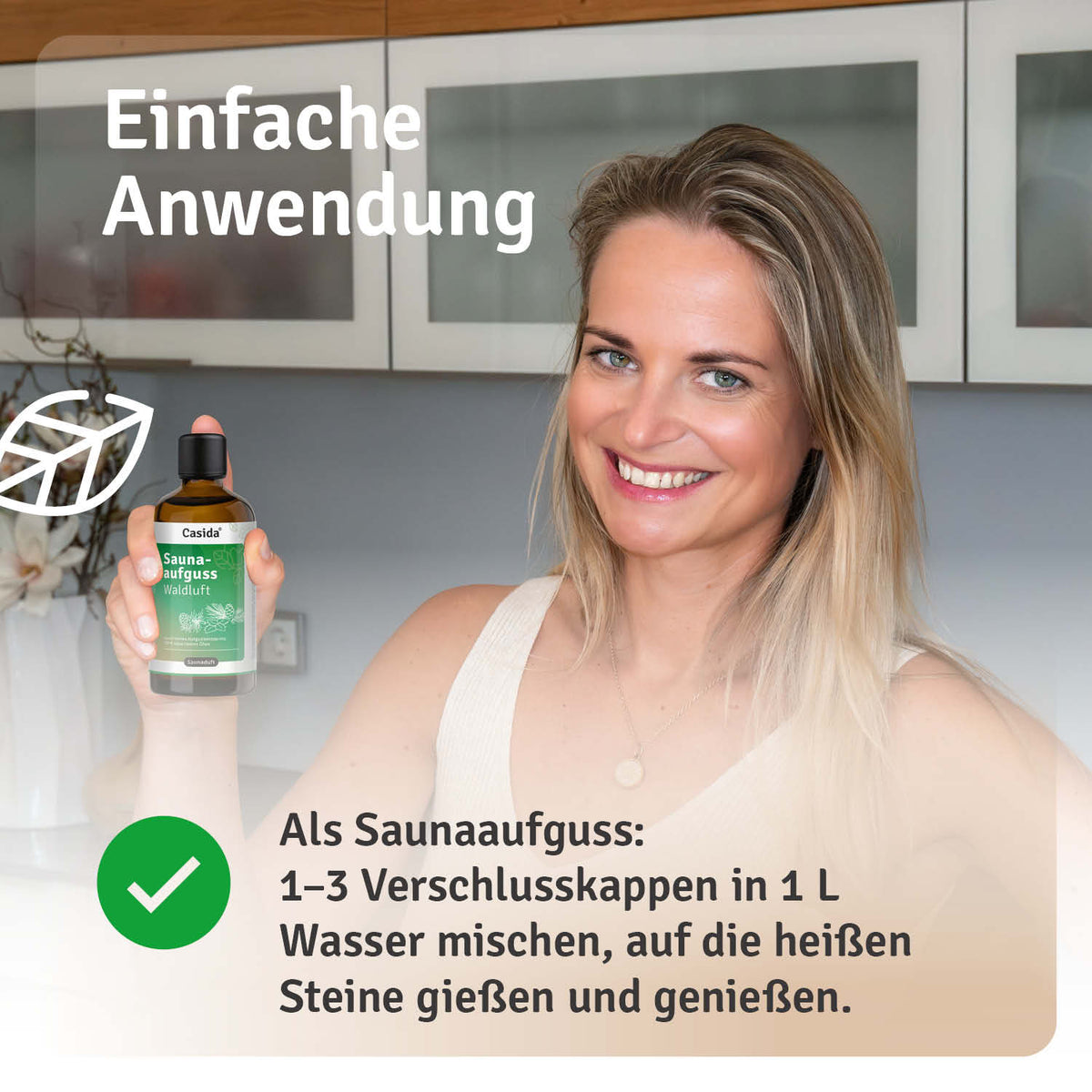 Saunaaufguss Waldluft oil bottle with a dropper, displayed on a countertop with a woman smiling in the background.