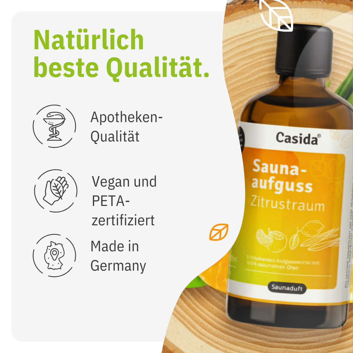 Saunaaufguss Zitrustraum oil bottle with citrus design, featuring vegan and PETA-certified labels, on a wooden surface.