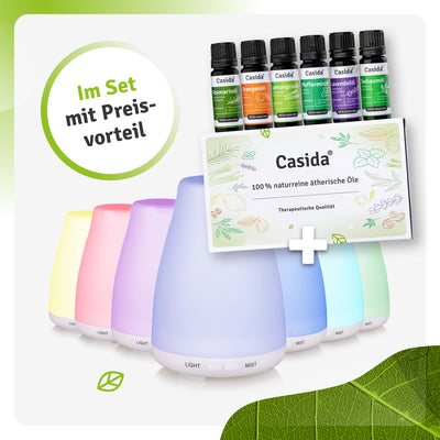 Aroma diffuser set with six colorful diffusers and essential oils in green and purple bottles, featuring a product informa...
